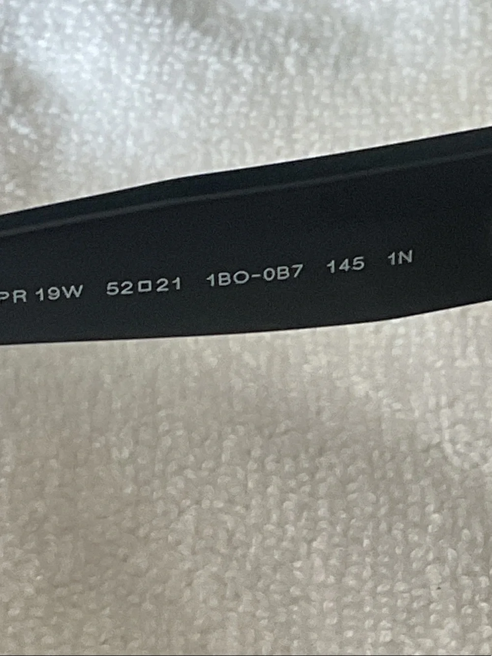 Prada Matte Black Rectangular Sunglasses with Amber Lenses